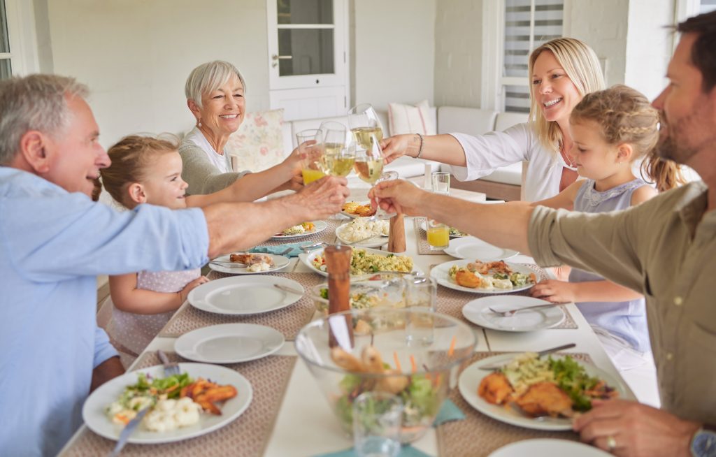 Shot of a family toasting during a sunday lunch.